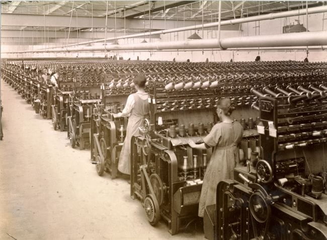 Workers twist yarn