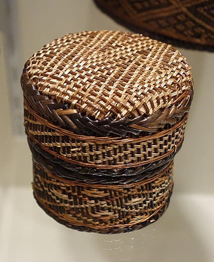 A lidded woven basket